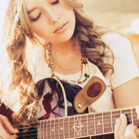 Beautiful girl playing a guitar