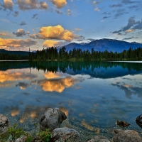 Clouds Reflecting In The Mountain Lake