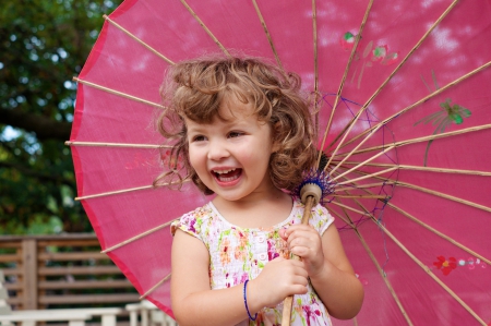 little girl - fun, people, eyes, belle, sightly, white, face, childhood, umbrella, fair, little, bonny, adorable, child, nature, beautiful, pink, sweet, beauty, photography, standing, pretty, baby, green, cute, kid, dainty, girl, lovely, pure, comely, blue, desktopnexus, smile, blonde