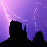 Lightning Over the Mittens Monument Valley Arizona