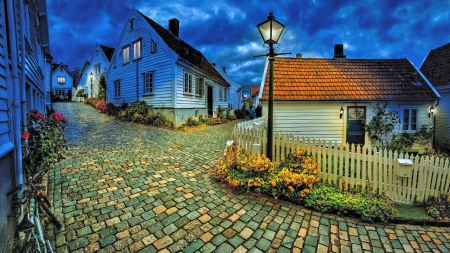 Night Falls On Spring Street - houses, street, urban landscape, norway, city lights, evening, clouds, beautiful, flowers