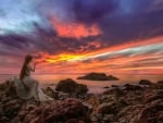 Girl Watching a Sunset at the Beach