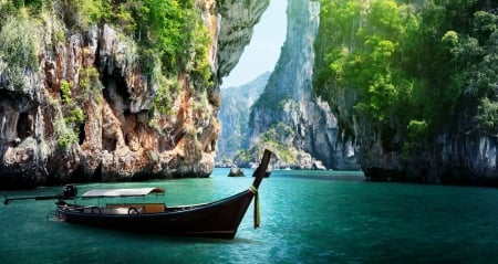 Long Boat And Rocks On Railay Beach