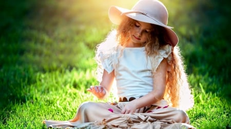 Small girl and hat - a small, girl, hat, grass