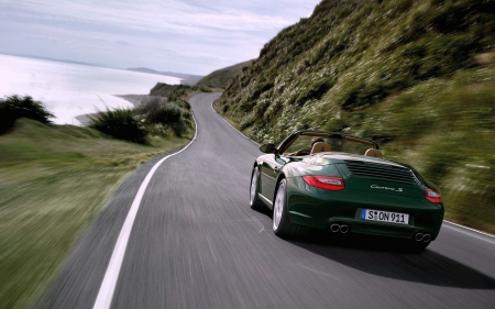 Zooming along in a Porsche Carrera - highway, porsche, cars, carrera