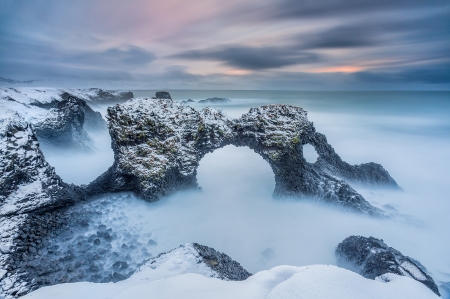 Iceland, Borgarfjordour - arch, clouds, sea, rocks