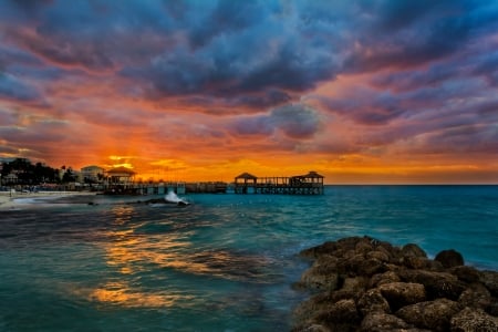 Sunset over Tropical Beach - clouds, oceans, blue, beaches, sea, sunsets, nature, tropical, turquoise, sky, rocks