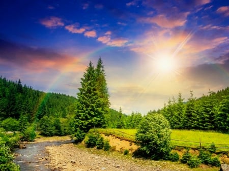 Dazzling sun and rainbow over mountain - rays, dazzling, sunshine, rainbow, sky, sunlight, mountain, trees, sun, summer, field, path, beautiful