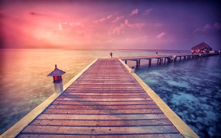 Paradise Pier - sky, paradise, sun, water, sunset, coast, vacation, purple, lanterns, lantern, evening, clouds, tropic, bungalow, skyphoenixx1, ocean, summer, tropical, shore, nature, holidays, pier, pink, sea