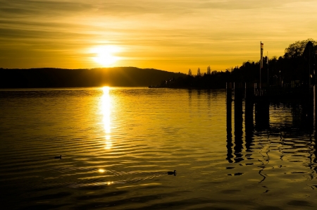 Yellow Sunset - lake, sky, landscape, sun, water, sunset, nature, silhouettes, pier, reflection, clouds, dusk