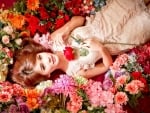 redhead surrounded by flowers