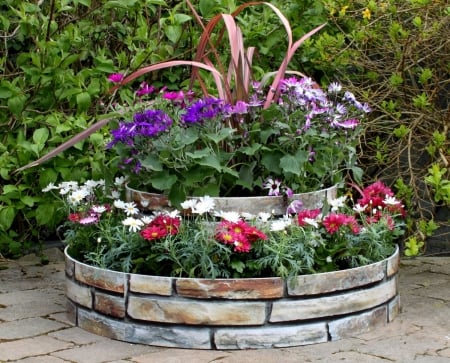 Flower Bed - round, blossoms, petals, stones, colors