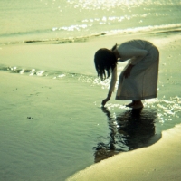 Girl looking for shells