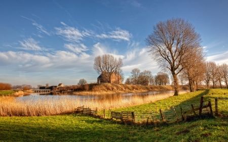 lovely sunny landscape in the netherlands hdr - fields, sky, fence, houses, trees, river