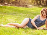 Beautiful blond lying on the grass