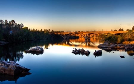 bridge over a calm river - trees, river, sunset, bridge, rocks