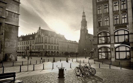 city square at sunrise in BW - squate, city, bw, stones, bikes, sunrise