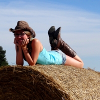 Relaxing On The Hay Bale