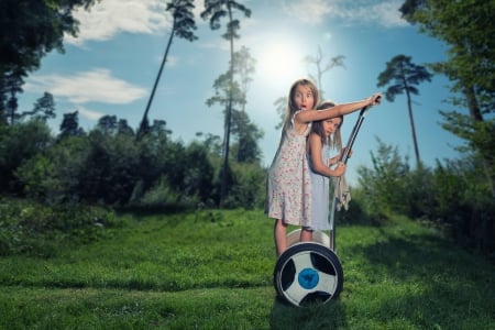 Funny girls - fetite, blue, girl, john wilhelm, blonde, copil, child, playing, funny, green, sister, little, couple, wheel