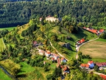 village in denmark under ruins on a hilltop hdr