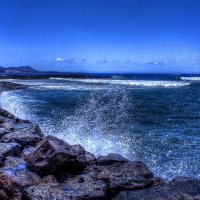 waves crashing a rocky shore hdr