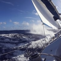 sailboat slicing through the waves