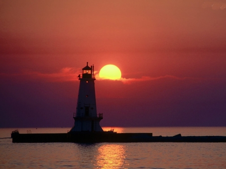 Lighthouse at Sunset - clouds, sunset, nature, lighthouse, sea, reflection