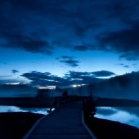 pier between sand bars at dusk