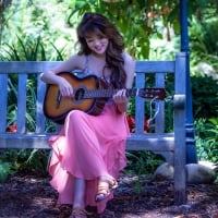 Girl in Pink Dress with a Guitar