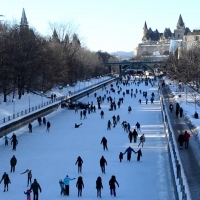 people skating on a frozen rideau canal in ottowa