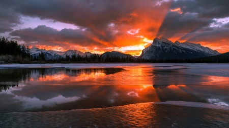 Sunrise Over Mountains - mountains, winter, water, lake, sky, morning, clouds, banff national park, trees, ice, mountain, sunrise, dawn, snow