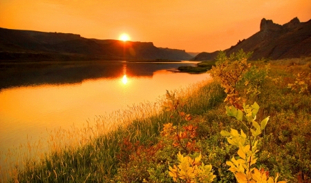 White Cliffs of the Missouri River - sky, sunlight, shore, sunset, glow, white, fiery, reflection, beautiful, river, golden, grass, photo, sunrise, cliffs, missouri