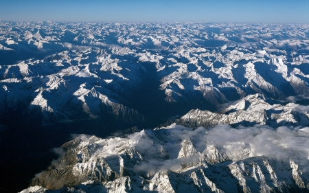 aerial view of a massive mountain range - clouds, aerial, range, view, snow, mountains