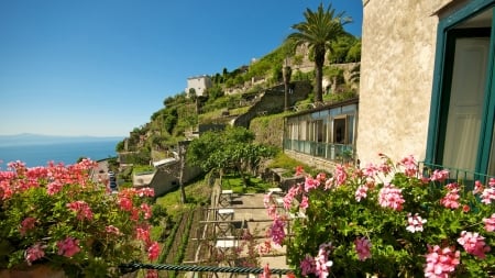 cliffside coastal town in italy - cliff, town, coast, flowers, sea