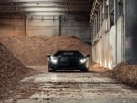 lambroghini aventador in a pile of wood chips