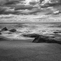 ocean waves on the beach in monochrome hdr