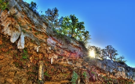 sun peeking over cliff with hanging stalactites hdr - stalactites, trees, cliff, hdr, sun