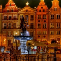 neptune in a town square fountain in poland