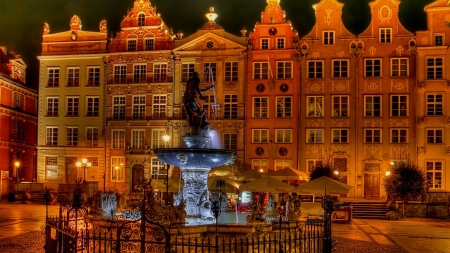 neptune in a town square fountain in poland - square, fountain, statue, city, night, buildings