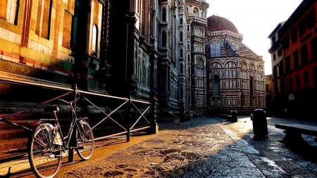 bike in a sun drenched side street - bike, railing, sunshine, city, side street