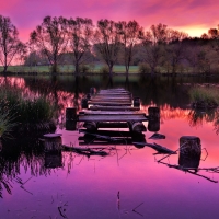 broken pier on a beautiful purple lake hdr