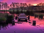 broken pier on a beautiful purple lake hdr