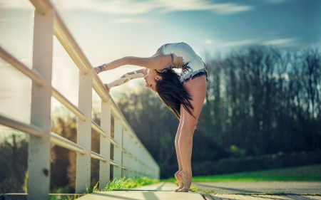 Gymnast - bokeh, trees, legs, photography, grass, fence, hair, nature, woman, art, sky