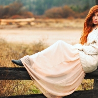 Cowgirl On A Fence . .