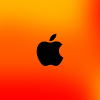 black apple on orange