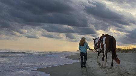 A Walk Along the Beach - woman, ocean, beach, lady, female, cowgirl, water, waves, pier, horse, clouds, sand