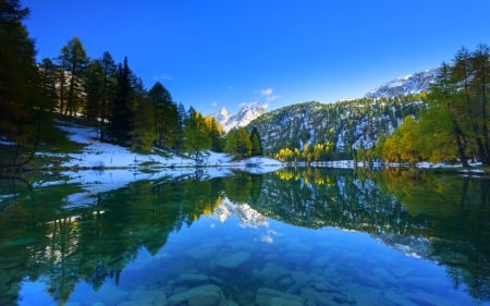 First Snow Of Autumn - calm, trees, water, beautiful, snow, blue sky, sunrise, morning, forest, reflection, mountain, alpine, autumn, cold, lake