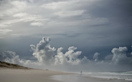 lone figure on cloud covered beach - person, sky, clouds, beach, sea