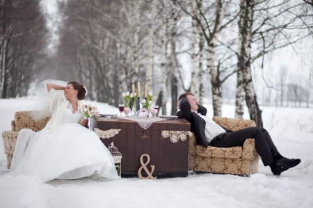 Winter Love - couples in love, trees, glasses, champagne, bride, tables, man, snowy trees, romance, love, wedding, two, drink, couple, girl, winter, groom, snow, armchair, flowers, dress