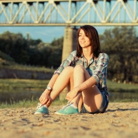 girl sitting in the sand